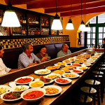 말레이시아 현지식과 서양식 레스토랑 비교 - A Vibrant Tapas Bar Scene in Seville**

"A bustling tapas bar in Seville, Spain, filled with happy p...